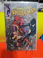 Front cover of The Amazing Spider-Man #258 comic book in protective plastic sleeve