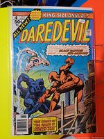 Front cover photo of Daredevil #4 King-Size Annual comic showing Daredevil battling Black Panther, with Namor in background.
