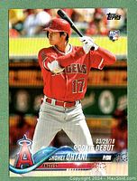 Front of the card showing Shohei Ohtani batting, Angels uniform, RC logo, and "Rookie Debut" text with date 03/29/18