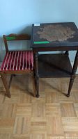 Photo of small wooden table and chair side by side showing condition and size.
