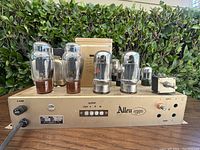 Front and top view of Allen Organ 90 monoblock tube amplifier showing beige chassis with mounted vacuum tubes and various input/output controls
