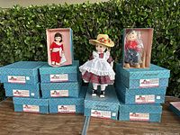Five vintage Madam Alexander dolls shown with three dolls displayed outside boxes and two dolls boxed