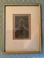 Full framed print, showing overall item under glass with decorative gold frame and matting.