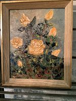 Framed vintage oil painting showing thick textured yellow roses with green leaves.