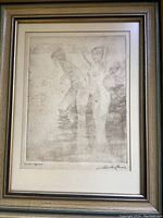 Photo of framed vintage signed print art depicting nude figures in water with visible artist signature.