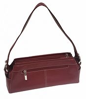 Front angle view of the burgundy red handbag showing zippered front pocket and shoulder strap attachment.