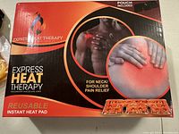 Box showing Express Heat Therapy branding and product details including use for neck/shoulder pain relief.