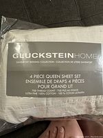 Gluckstein Home 4-piece queen sheet set packaging label showing brand, collection, thread count, and material details.