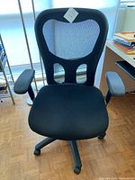 Front view of the black Tempur-Pedic TP9000 task chair showing mesh back and padded seat.