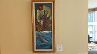 Full view of framed vertical oil painting depicting fisherman and fish hung on wall with auction lot tag.