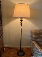 Full view of lamp showing base, stem and shade