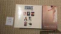 Photo of the Stanley Kubrick Collection VHS box set and Angels in America VHS box set showing front covers.