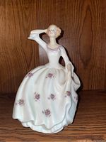 Front view of Royal Doulton 'Maureen' porcelain figurine showing detailed floral patterns on flowing dress and pose.