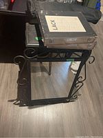 Wood metal framed decorative mirror with scrollwork, with IKEA LACK floating shelf boxes stacked on top