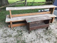 Four wooden benches: three long benches stacked and one smaller storage bench in front.