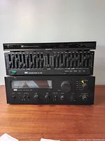 Front view of the Sony DVD player, equalizer, and stereo receiver stacked.