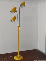 Full view of lamp showing base, stem and three shades