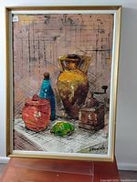 Frontal photo of the oil painting showing still life composition of vessels and signed bottom right.