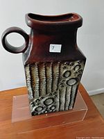 Large mid-century vintage ceramic vase by Carstens with a dark brown and beige textured glaze, ring handle and rectangular shape.