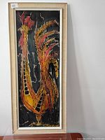 Full view of framed stylized rooster painting with visible signature Chuard in bottom right.