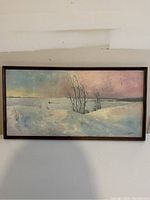 Front view of framed oil painting showing winter landscape scene.