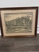 Framed print showing the full artwork and frame on floor against wall.