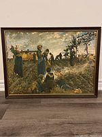 Front view of the framed textured print showing a rustic Tuscany scene of people seeding farmland with horses, in earth tones.