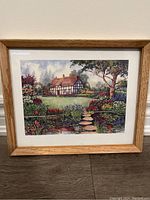 Front view of the framed print showing house, garden, pond, and stepping stones