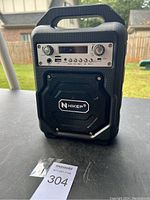 Front view of Hikep HP-23 Bluetooth speaker showing control panel with knobs, buttons, USB port, TF card slot, and a built-in speaker grill with Hikep logo.