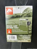 Tag showing product details including weight capacity 66 lbs, easy setup, plastic kitchen sink, adjustable lantern stand, and utensil hooks.