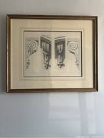 Full view of the framed architectural detail print hung on wall.