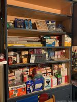 Four-shelf unit filled with packaged light bulbs across four levels