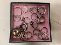 Assortment of rings in pink-lined box