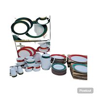 Full view of both red and green Royal Heritage Christmas dish sets including plates, cups, saucers, and additional serving items for green set.