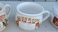 Side view of large white ceramic Campbell's Mushroom Soup bowl with printed recipe and graphics around the outside