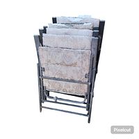 Four foldable metal frame lawn chairs stacked and folded, fabric has noticeable wear and needs repairs