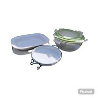 Overview of all items including white rectangular baking dish, porcelain pie plate with metal holder, and stacked glass nesting bowls with lids.