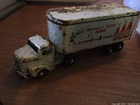 Side view of assembled truck and trailer showing Heinz Ketchup graphics and cartoon boy illustration on trailer