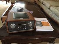 Tangent Quattro MKII internet radio on table with user manual visible beside it