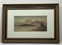 Full view of framed painting showing decorative gold-tone frame and double white mat.