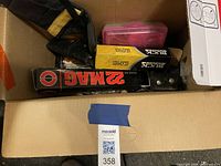 Box view showing firearms accessories and packaging inside.