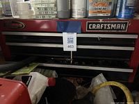 Front view of red Craftsman tool chest with visible drawers and some storage on top.