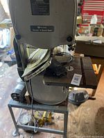 Front view showing cast iron table, blade, and included Olson blades