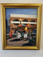 Full view of the framed oil painting showing the downtown street scene with figures, cart, balloons, and building.