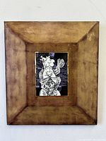 Full front view of the Holocaust Hungarian porcelain plaque with leather frame showing detailed abstract figure art and aged leather frame.