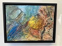 Framed vibrant abstract painting showing textured vibrant colors and signed by Karen Leslie Hall.