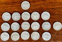 Seventeen quarters arranged in rows showing reverses