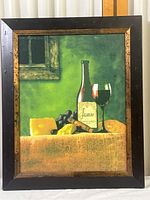 Full view of Jasmine Vineyards 2005 print with wine bottle, wine glass, cheese, grapes, and green background inside black and gold frame.