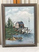 Frontal photo of original fishing boat oil painting in wooden frame.