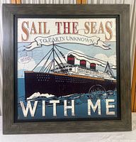 Front view of the framed vintage style nautical print showing the ship and main text